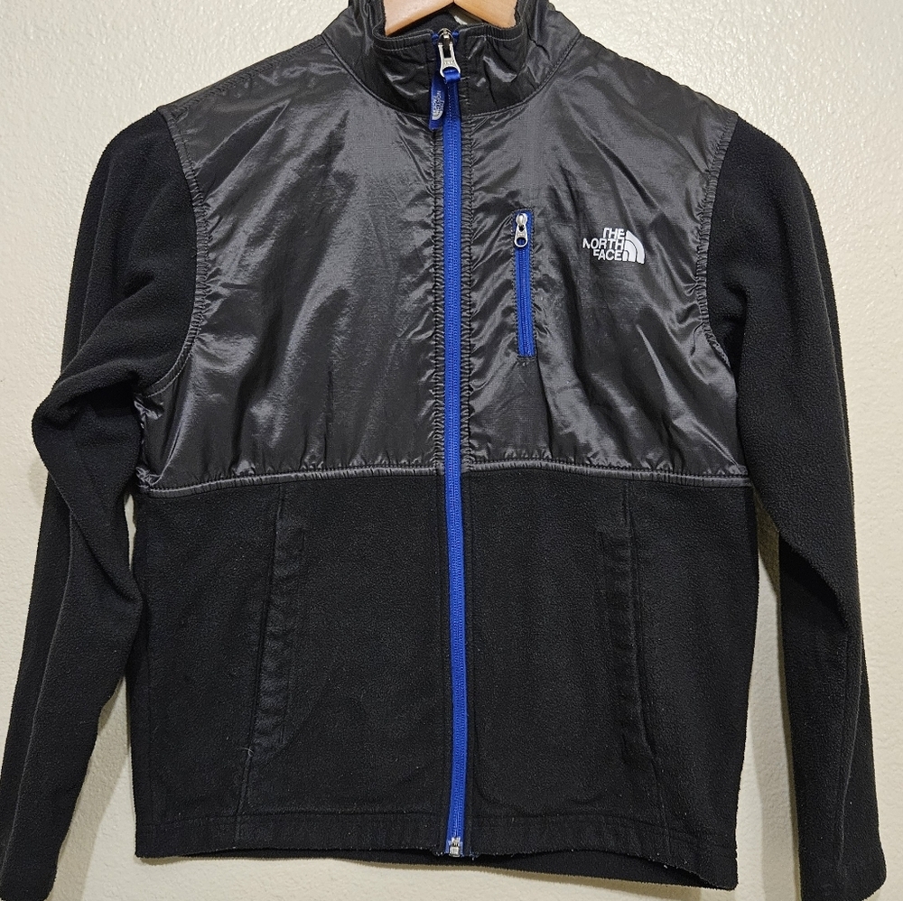 The North Face Kids Performance Jacket in Black with Blue Zipper